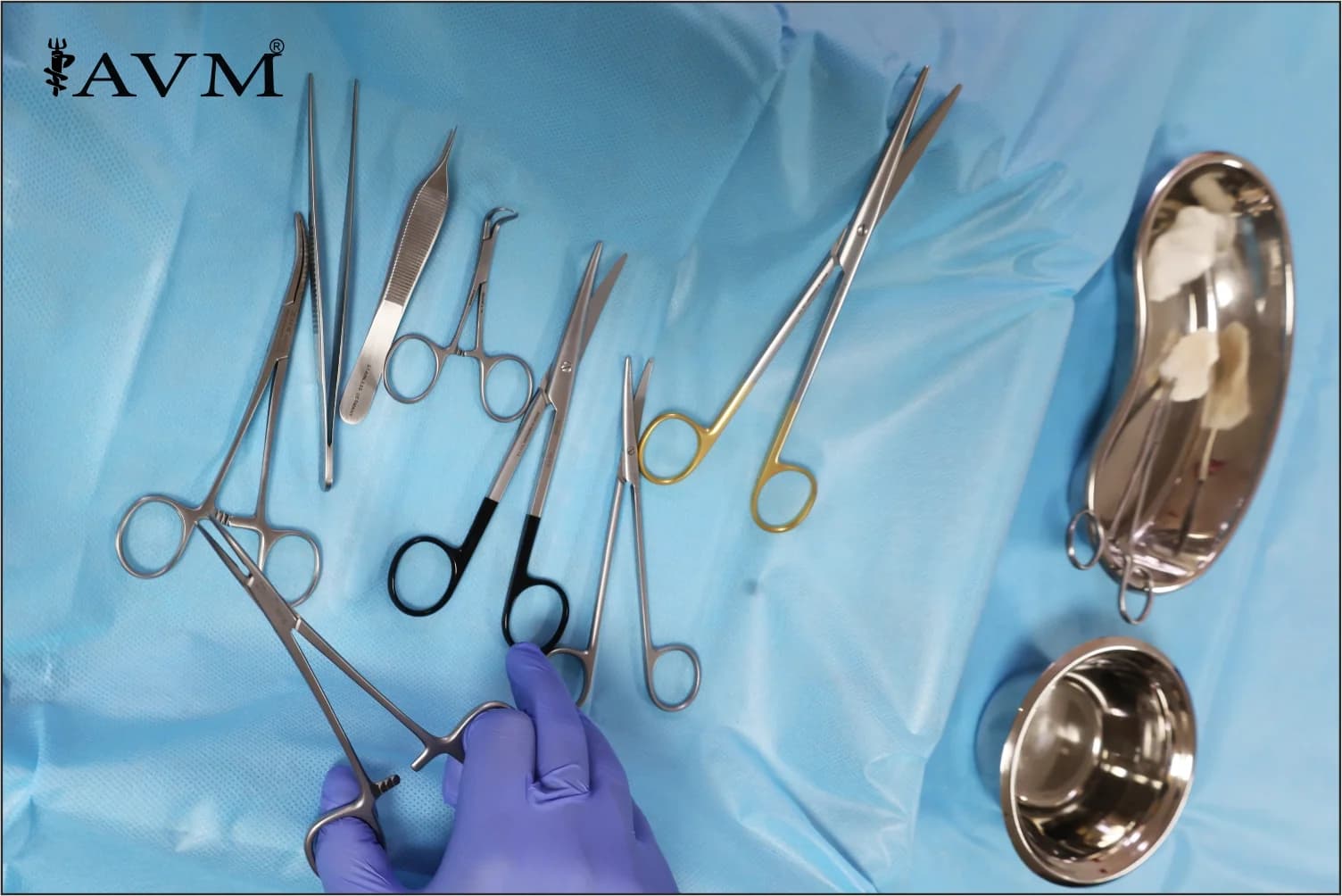 A gloved hand placing a surgical instrument onto a tray
